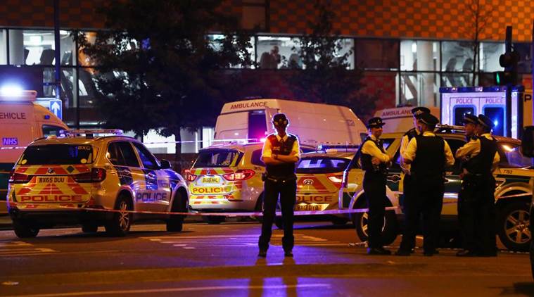 Police officers attend to the scene after a vehicle collided with pedestrians in the Finsbury Park neighborhood of North London
