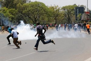 ers of the opposition National Super Alliance coalition run after riot policemen dispersed protesters during a demonstration calling for removal of Independent Electoral and Boundaries Commission officials in Nairobi, Kenya