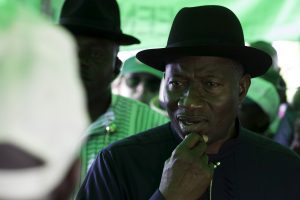 Nigeria’s President Goodluck Jonathan reacts as his permanent voter’s card failed to register during accreditation in his ward in Otuoke
