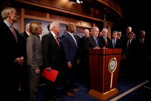 Senate Majority Leader Mitch McConnell, accompanied by members of the Republican Conference, speaks at a news conference about the passage of the Tax Cuts and Jobs Acts at the U.S. Capitol in Washington