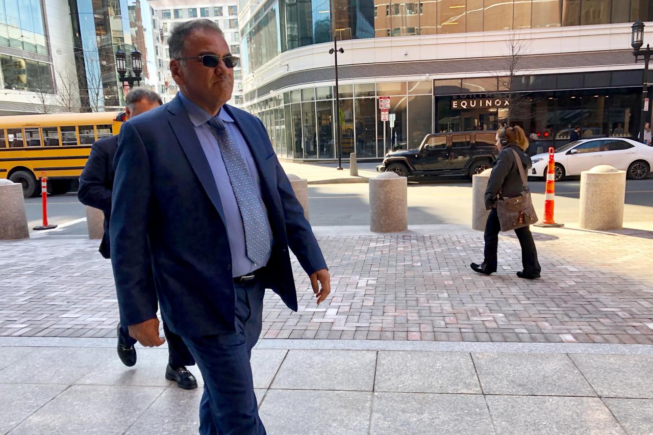 Dr. Montana of Atlanta, Georgia enters the federal courthouse in Boston