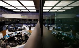The trading room of Frankfurt’s stock exchange is reflected in the window of the visitor’s gallery during afternoon trading session in Frankfurt