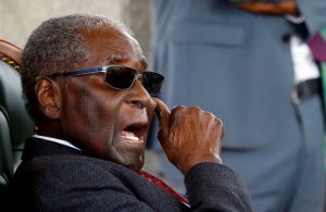 Zimbabwe’s former president Robert Mugabe gestures during a press conference at his private residence nicknamed “Blue Roof” in Harare