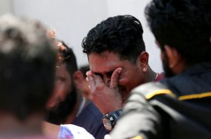 A relative of a victim of the explosion at St. Anthony’s Shrine, Kochchikade church reacts at the police mortuary in Colombo