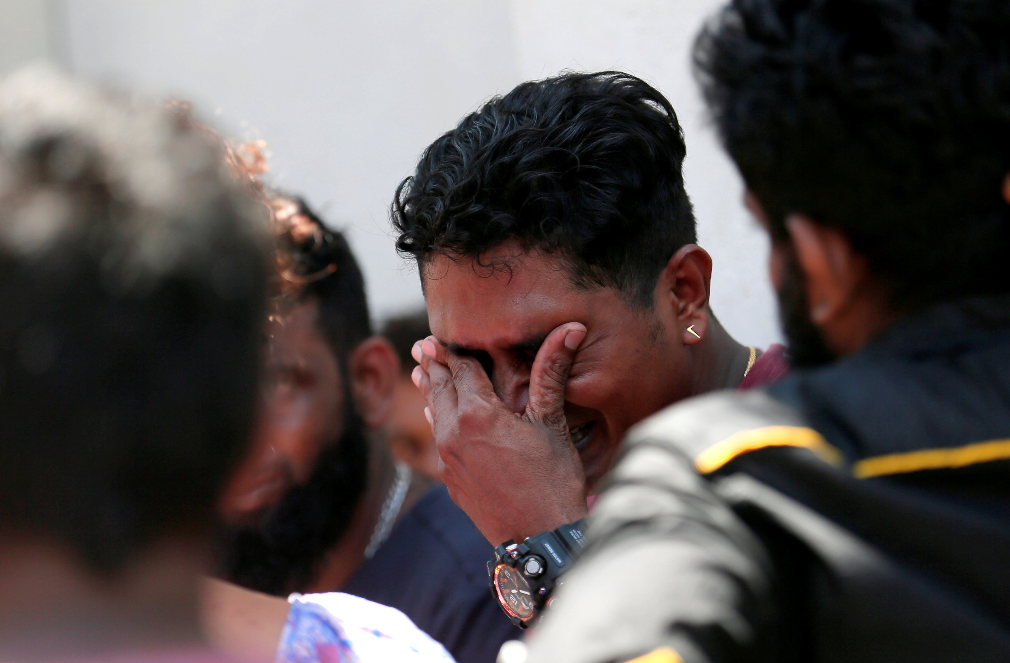 A relative of a victim of the explosion at St. Anthony’s Shrine, Kochchikade church reacts at the police mortuary in Colombo