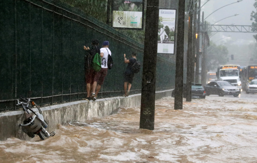 At least 10 killed as heavy rains trigger landslides in Rio de Janeiro, Brazil.