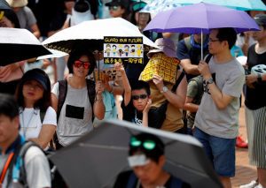 Family members participate in a protest rally titled “Guard Our Children’s Future” at Edinburgh Place in Hong Kong, China