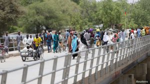 People cross the bridge linking Cameroon to Nigeria at Gamboru/Ngala in Borno, Nigeria