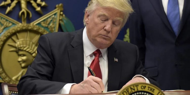 Trump signs order halting immigration into US