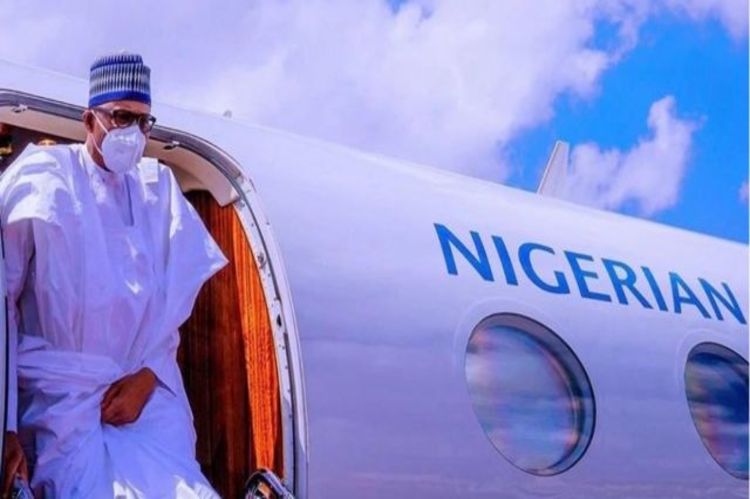 Buhari returns to Abuja after peace mission to Mali