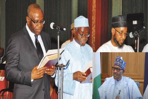 Updated: Buhari signs six new national commissioners for INEC