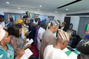 Lagos State APC newly elected exco being inaugurated at the party secretariat on Friday in Lagos.