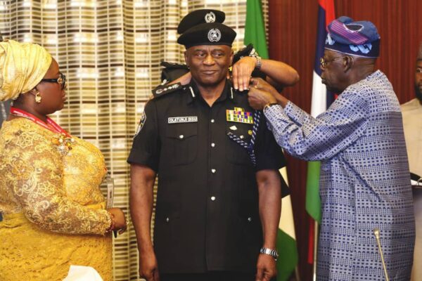 Tinubu decorates Disu as Acting IGP